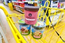ben and jerry's and talenti stacked in yellow shopping cart