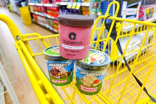 ben and jerry's and talenti stacked in yellow shopping cart