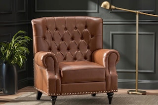 a brown faux leather recliner chair