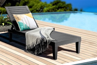 Lifestyle image of the Gymax Outdoor Chaise Lounge Chair set up by a pool