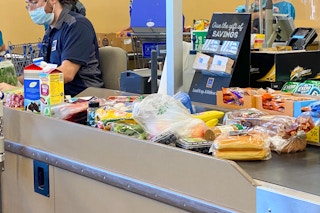 ALDI checkout with groceries on the conveyer belt