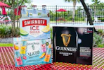 Smirnoff, Guinness, and Captain Morgan products in a pool area