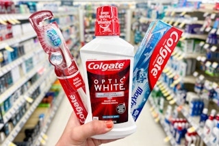 hand holding colgate products