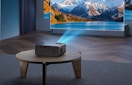 a mini projector on a wooden table 