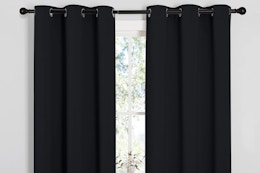 blackout curtains hung up around a window