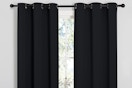 blackout curtains hung up around a window