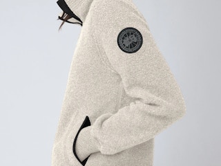 a person wearing a jacket from Canada goose