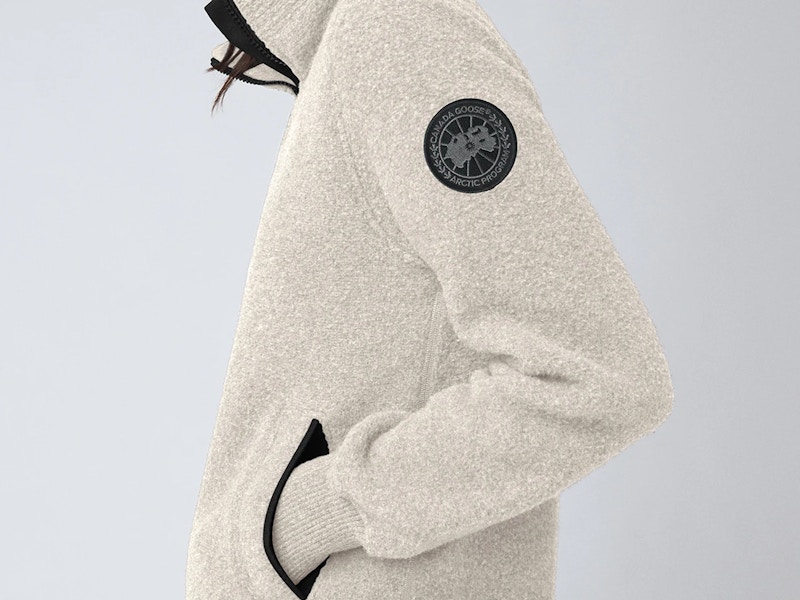 a person wearing a jacket from Canada goose