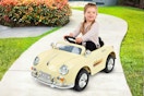 Lifestyle image of the Lil' Rider 6V Kids Ride-On Car used outdoors on a pavement