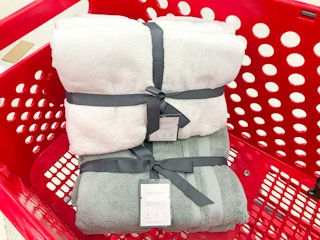 white and gray Threshold towels sets in a Target cart