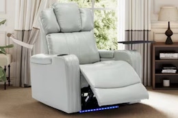 Lifestyle image of the gray PU leather Merax power recliner with LED lights in home setiing