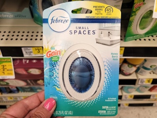 hand holding a febreze small spaces package