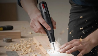 a person using a rotary tool 