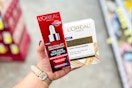 person holding loreal paris skincare products