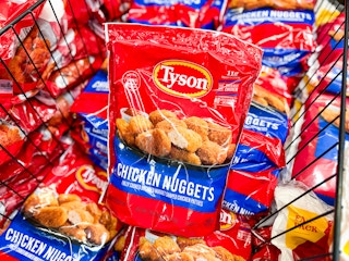 29-ounce Tyson chicken nugget package on top of other bags