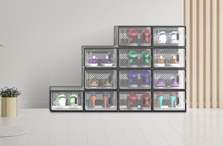 clear shoe boxes stacked against a wall