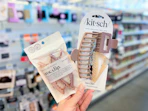hand holding kitsch hair accessories in walgreens