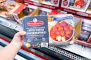 hand holding mama mancini's chicken stuffed meatballs at costco