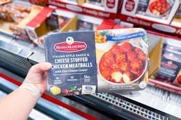 hand holding mama mancini's chicken stuffed meatballs at costco