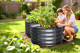 Lifestyle image of 2 raised gardens bed with a mother and son using them to plant vegetables