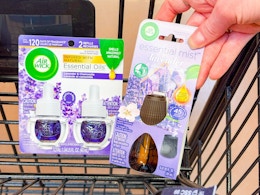 hand holding air wick products in shopping cart