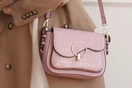 a woman with a MKF collection croc shoulder bag