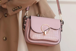 a woman with a MKF collection croc shoulder bag