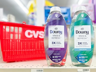 two bottles of Downy Rinse & Refresh next to CVS shopping basket
