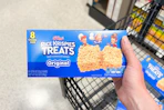 hand holding a box of kelloggs rice krispies treats