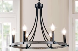 Lifestyle image of the rustic wagon wheel (farmhouse style) 6-light chandelier in home setting
