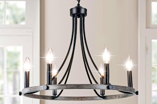 Lifestyle image of the rustic wagon wheel (farmhouse style) 6-light chandelier in home setting