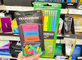 hand holding ticonderoga pencils and erasers