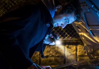 a guy using a flashlight