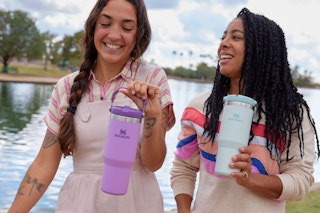 two women using stanley tumblers