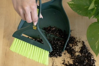 Pine-Sol mini dustpan and brush set cleaning up dirt