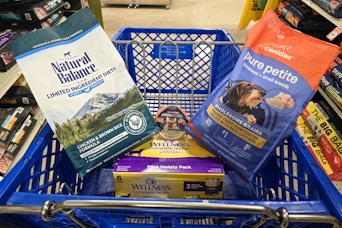 petsmart shopping cart with dog food in it