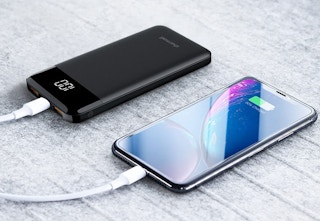 a phone next to a portable charger