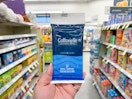 hand holding cottonelle wipes in walgreens
