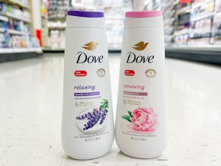 bottles of dove body wash on floor