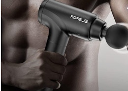 a person holding a massage gun