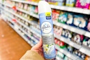 person holding glade air freshener 