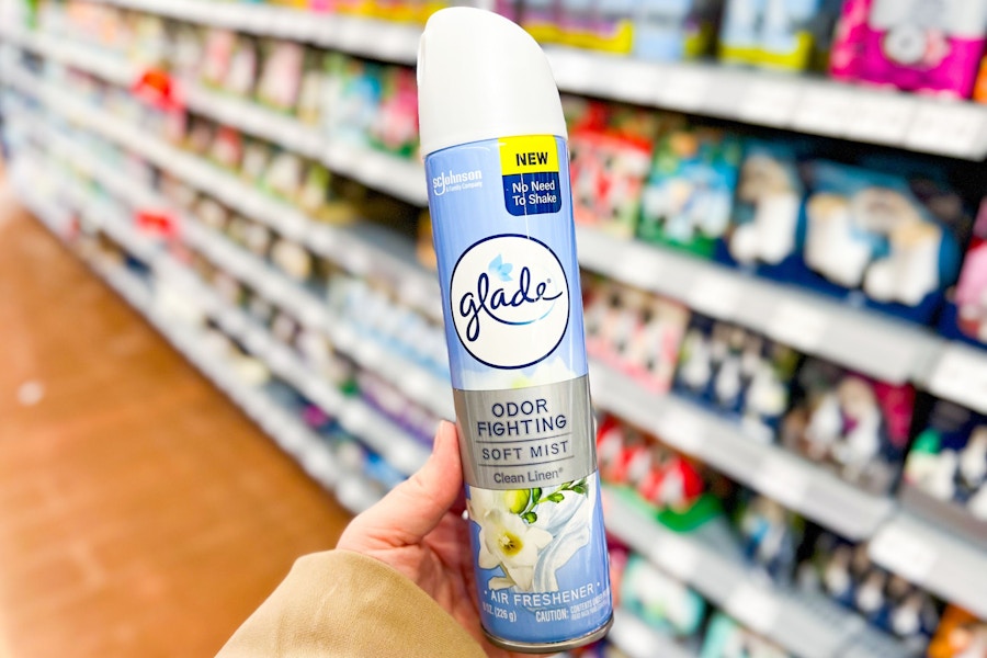 person holding glade air freshener