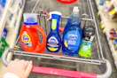 tide detergent, downy scent beads, and dawn dish soap in a cart