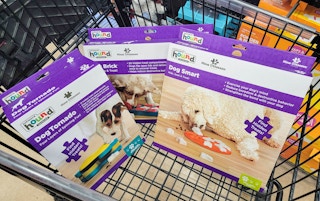 outward hound puzzle dog toys in a cart