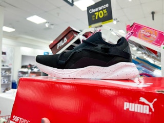 a black and white women's puma shoe