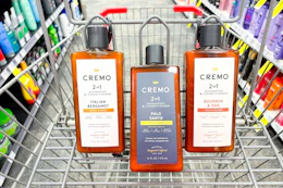 3 bottles of cremo shampoo in a cart