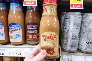 hand holding a bottle of victor allens iced coffee