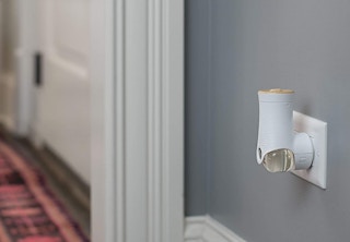 White fragrance plugin in a grey wall