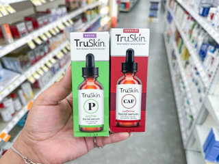 hand holding truskin serums in walgreens