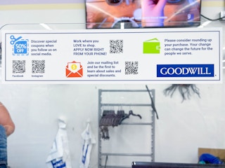 goodwill info signs at cash register 